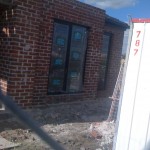 Front of house with bricks completed